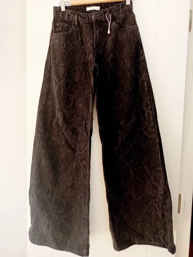 Vaqueros anchos negros animal print Talla S