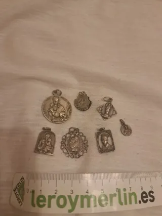 Lotto di 7 piccole medaglie religiose in argento