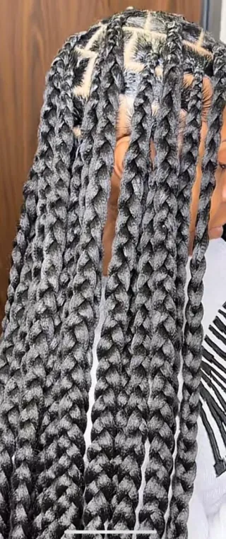 Trenzas de caja con extensiones naranjas