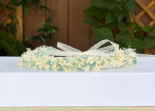 Corona de flores preservadas