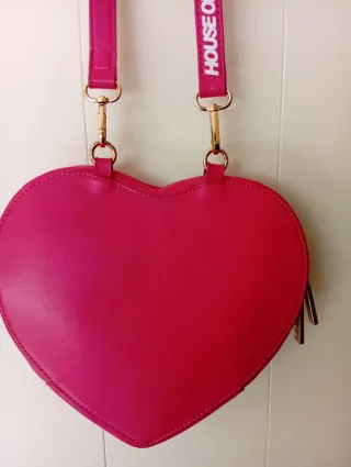 Bolso rosa con cremallera dorada