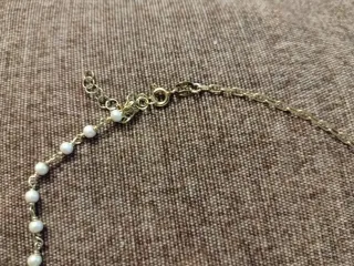 Collar con perlas y estrella dorada