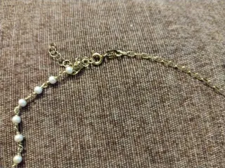 Collar con perlas y estrella dorada