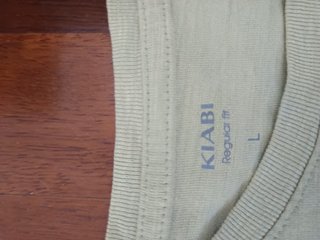 Maglietta verde con stampa surf