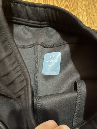 Pantalones Nike NOCTA Negros y Dorados