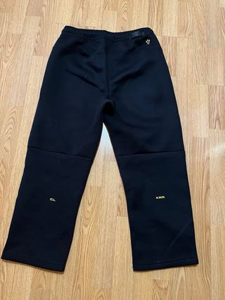 Pantalones Nike NOCTA Negros y Dorados