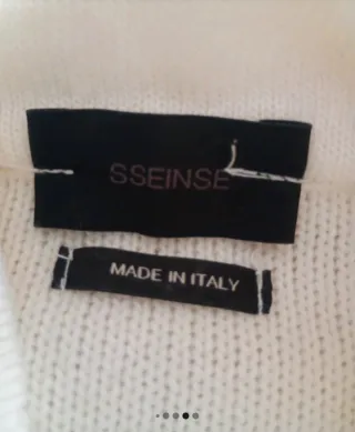 maglione bianco collo particolare