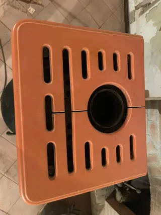 Stufa a legna Montegrappa ceramica arancione