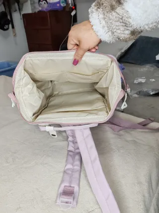 Mochila rosa con monedero y parche