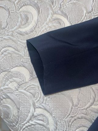 Americana vintage azul con botones dorados