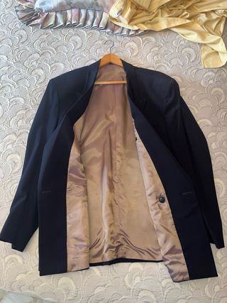 Americana vintage azul con botones dorados