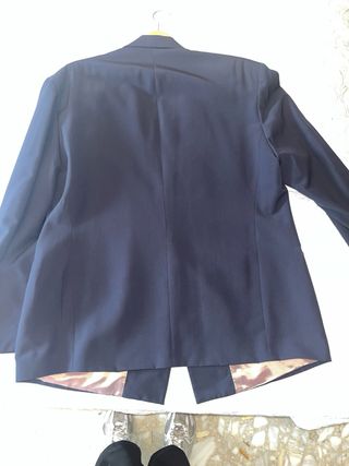 Americana vintage azul con botones dorados