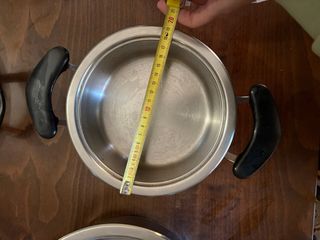 Set di 7 pentole metalliche con coperchi AMC