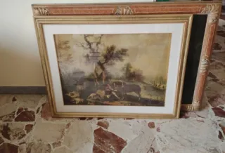 Quadro con cornice dorata e decorazioni