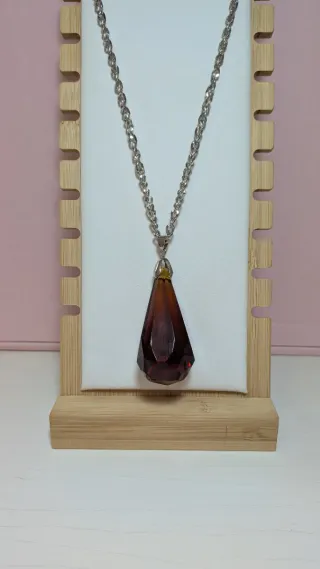 Péndulo de cristal marrón y plata