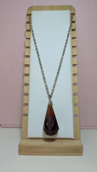 Péndulo de cristal marrón y plata