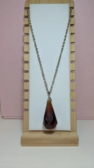 Péndulo de cristal marrón y plata