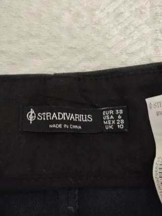 Mini falda efecto piel negra