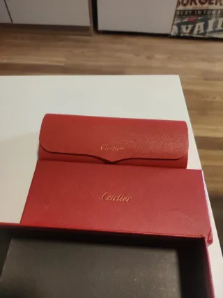 Gafas de sol Cartier negras y doradas