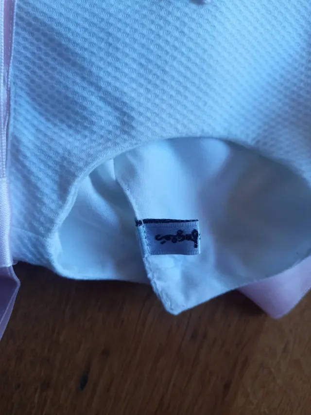 Vestido de bebé blanco con lazos rosas