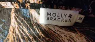 Blusa donna con stampa piuma