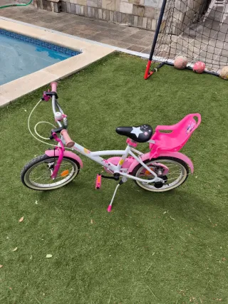 Bicicleta niña rosa con asiento para muñecas