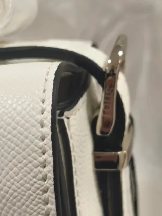 Bolso Tous Blanco y pulsera plateada