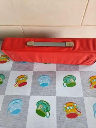 Melódica Hohner con funda roja