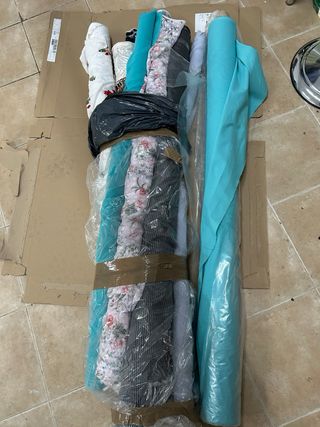 Rollos de tela variada  En total 11 rollos