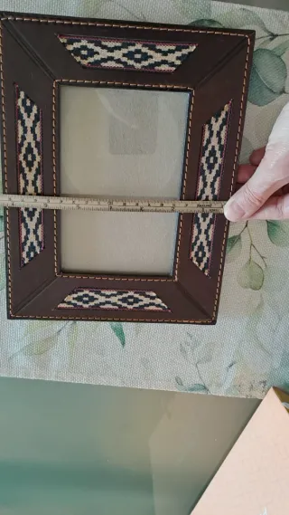 Cornice portafoto in pelle con decorazioni