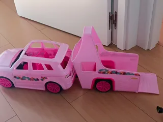 Coche de juguete rosa para muñecas
