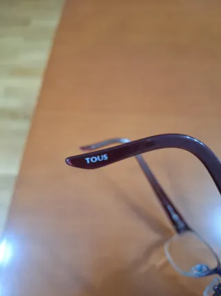 Montura de gafas Tous granate