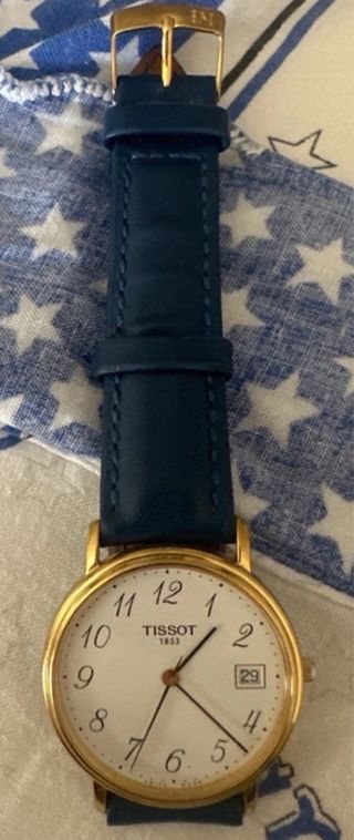 Orologio Tissot dorato con cinturino blu