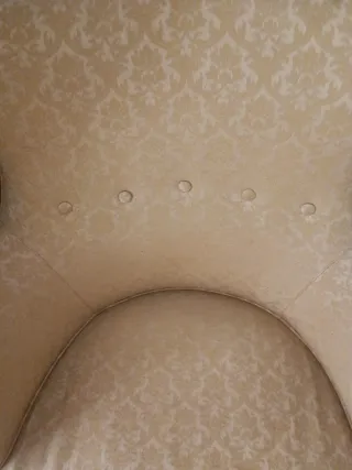 Coppia di poltrone imbottite con frange