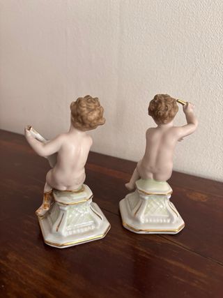 Coppie di statuette cherubini in porcellana