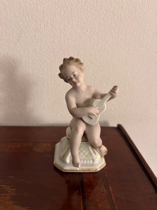 Coppie di statuette cherubini in porcellana