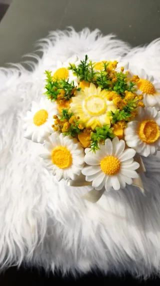 Ramo di candele profumate con fiori di margherita