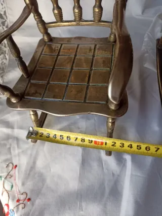 2 dondoli in bronzo in miniatura. 75€/2