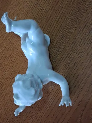 Coppia di putti in ceramica