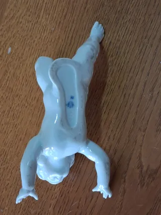 Coppia di putti in ceramica