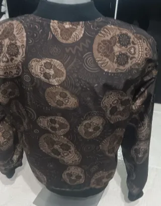 Giubbotto reversibile da uomo nero con teschio