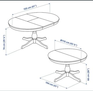 Mesa redonda extensible de madera restaurada.