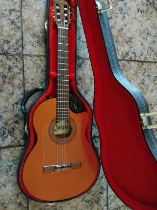 "Rebajada"Guitarra amplificada estrecha  cam