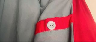 Plumas rojo reversible gris