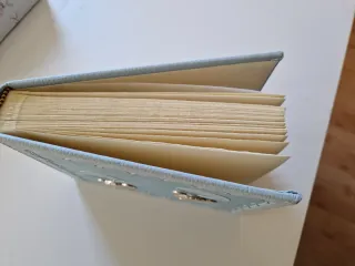 Álbum de fotos azul con elefantes