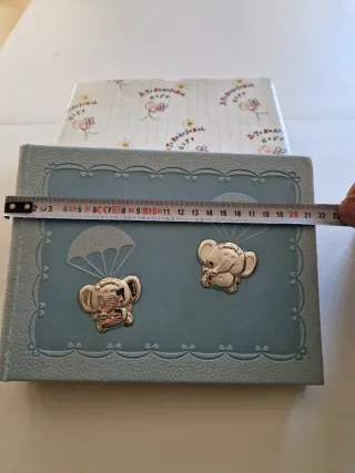 Álbum de fotos azul con elefantes