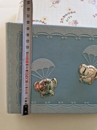 Álbum de fotos azul con elefantes