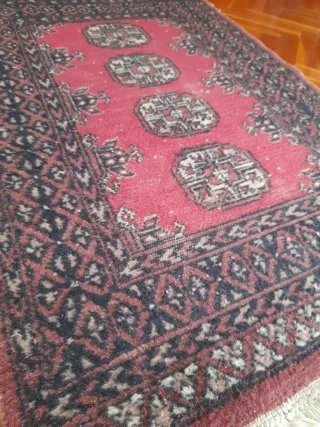 Antigua alfombra en lana.