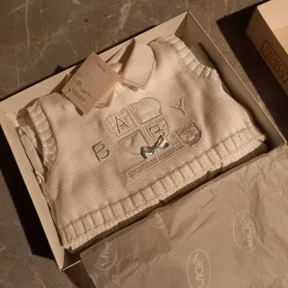 Tutina neonato in maglia bianca