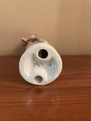 Figura de porcelana niño con hatillo